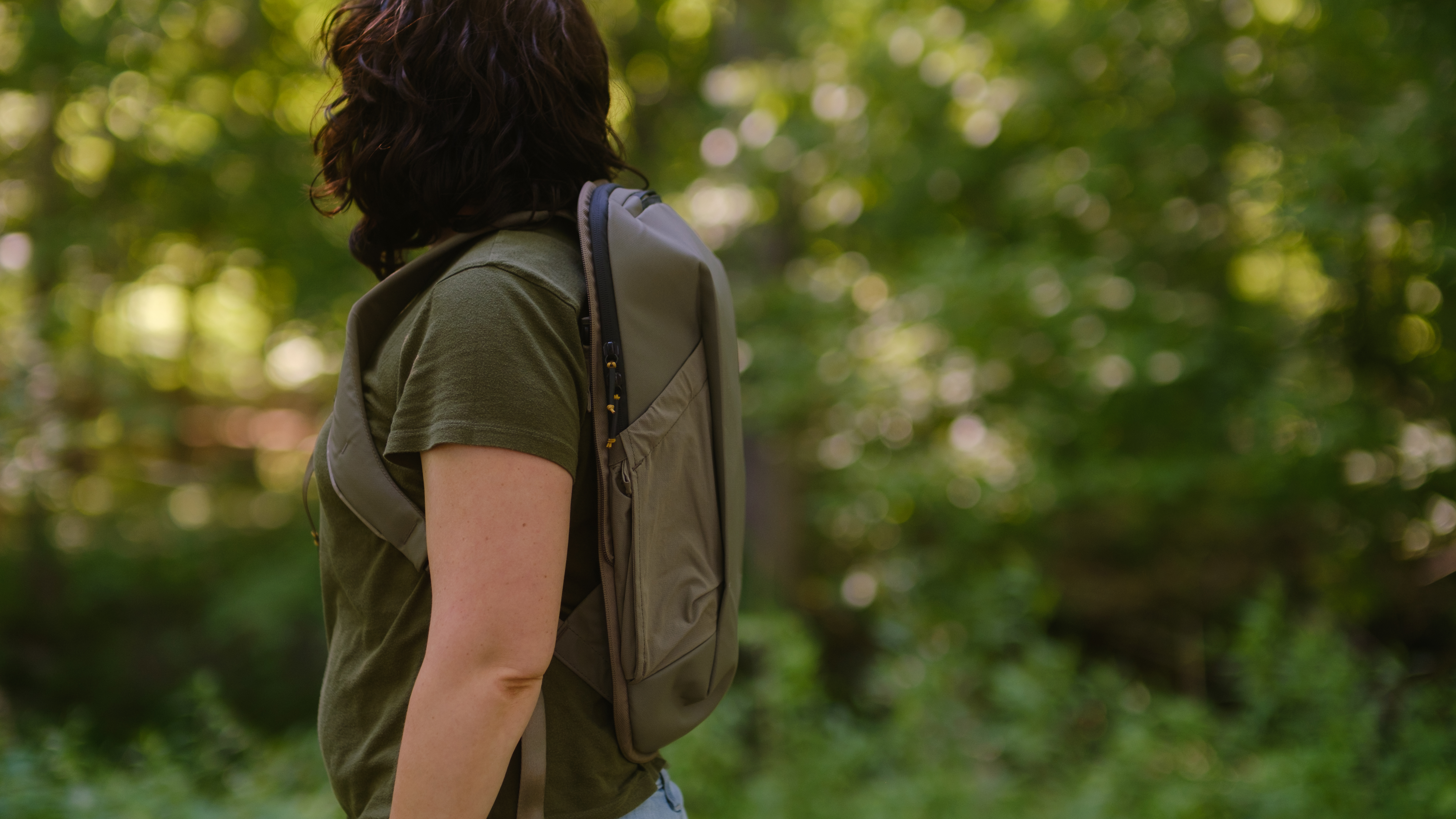 The Peak Design Travel 2-in-1 Backpack outdoors used by a photographer
