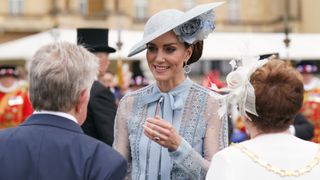 Catherine, Princess of Wales talks to guests during a Garden Party
