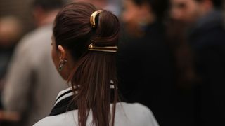 woman wearing a ponytail and barrette clip