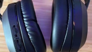 close up on leatherette earcups of Turtle Beach Stealth 500. The left is puckered around the join with the main plastic chassis and appears wrinkled.