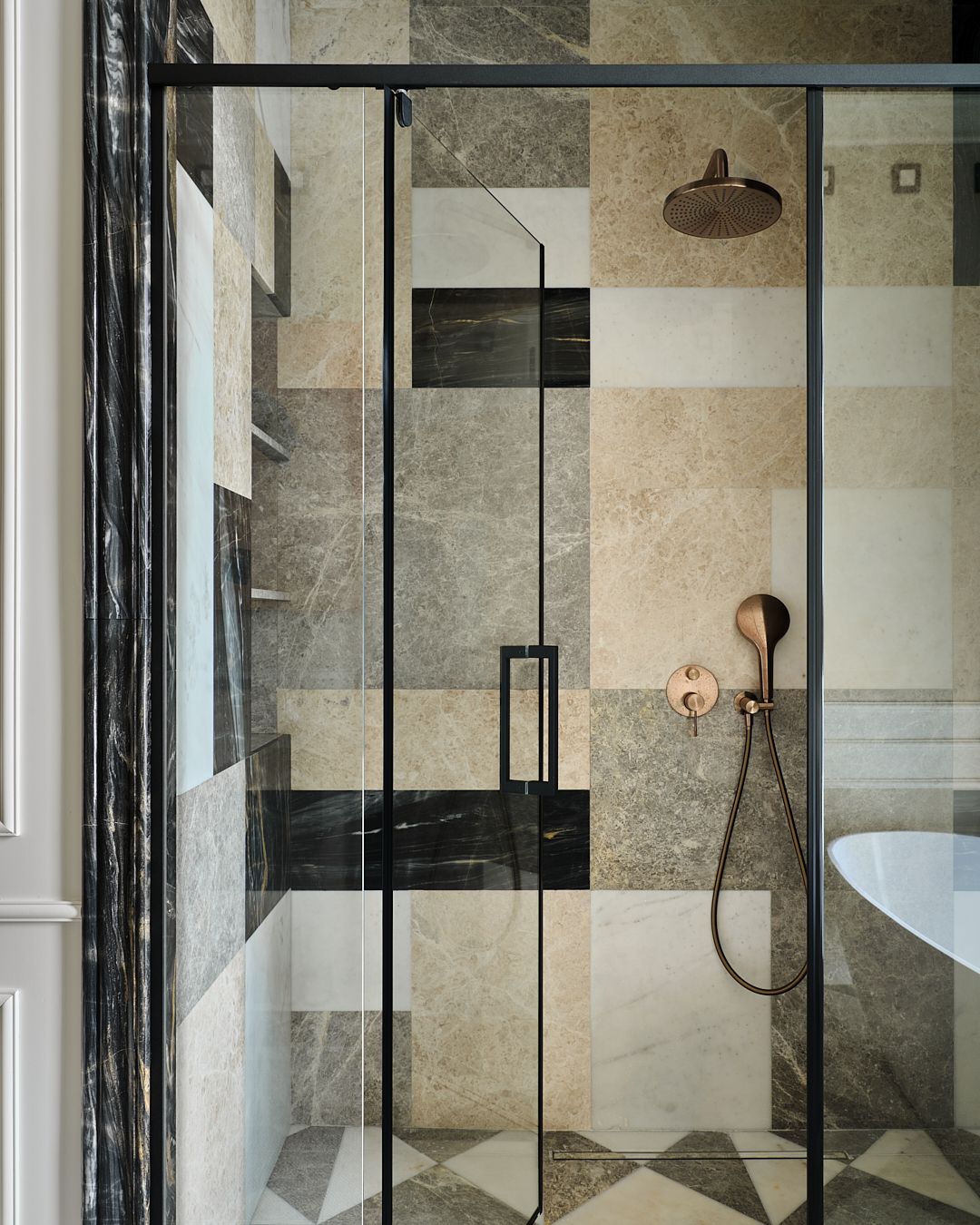 A custom-cut pattern of marble tiles in neutral ones