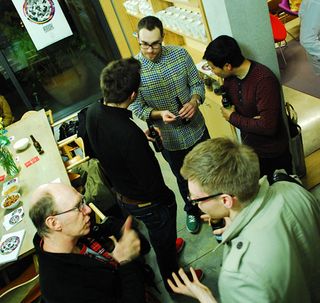 Guests and artists discussing the book