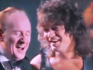 Les Paul and Eddie Van Halen share a laugh in 1988