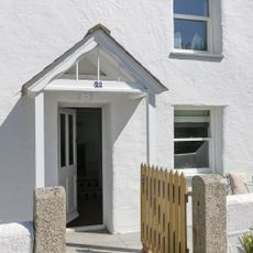 house exterior with white walls and door