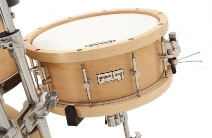 The snare drum has a 10-ply shell with matching 10-ply hoops and it boasts the superb Trick strainer