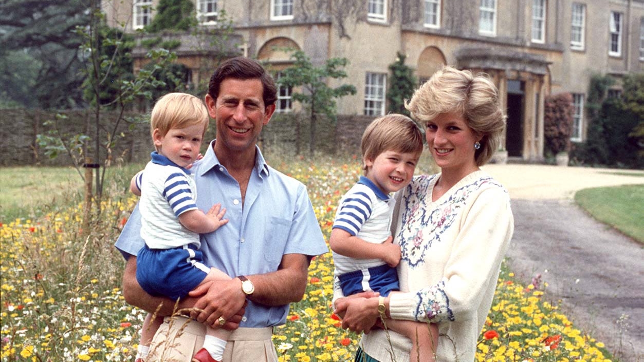 King Charles and Princess Diana hold Prince William and Prince Harry in the Wild Flower Meadow at Highgrove
