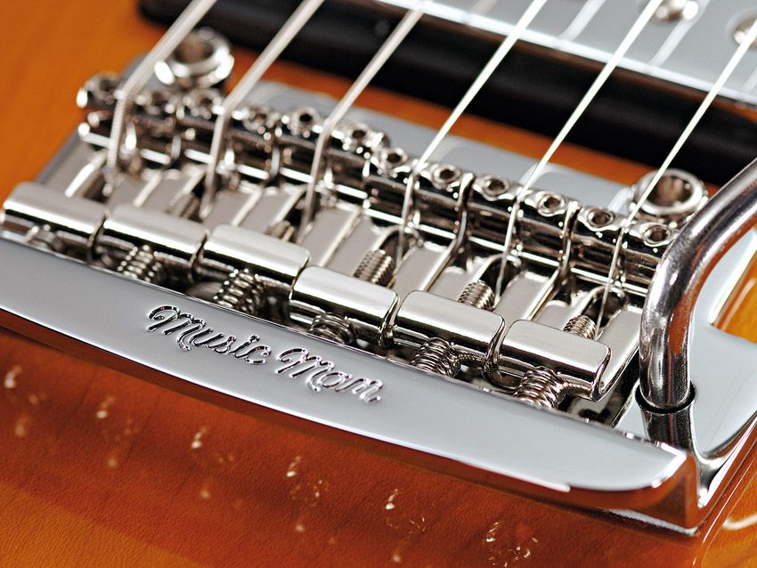 The efficient Music Man vibrato is an optional extra.