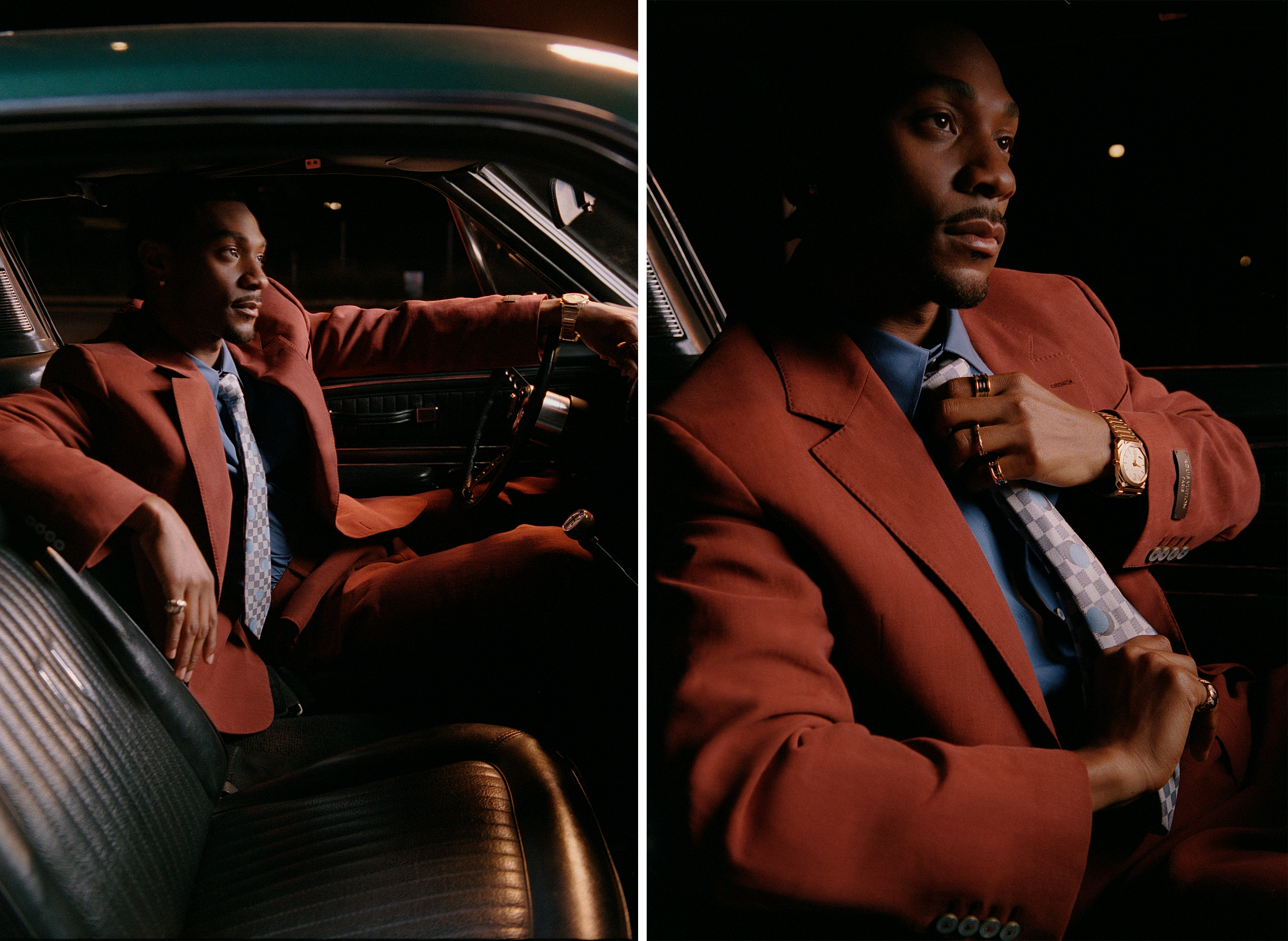 Jonathan Daviss wears a red suit with a blue shirt and patterned tie.