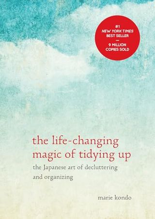 Book cover of the The Life-Changing Magic of Tidying Up: the Japanese Art of Decluttering and Organizing by Marie Kondo which has a sketched blue sky with puffy clouds