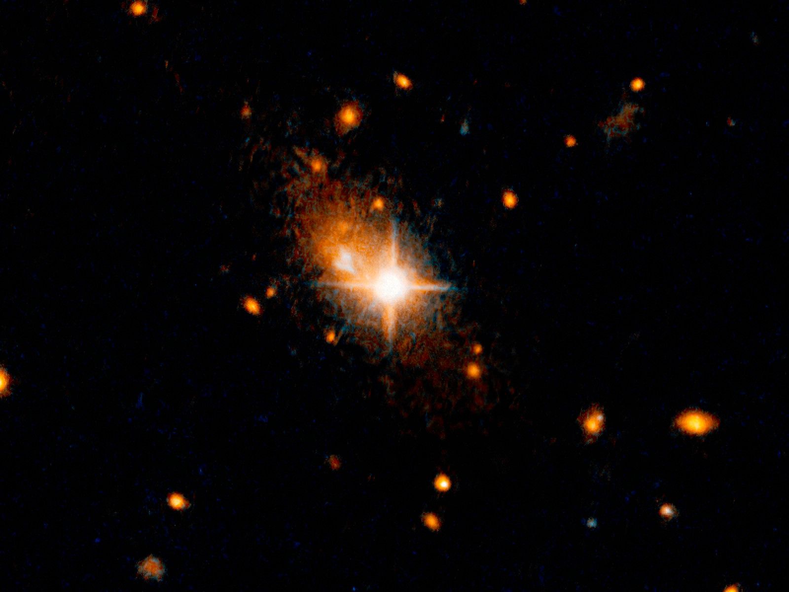 Gravitational Waves Boot Gigantic Black Hole from Galaxy's Core