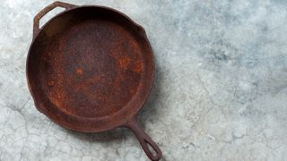 A rusty cast iron skillet