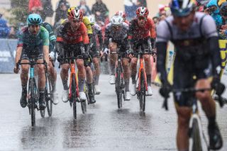 Riders cycle to cross the finish line of the 7th stage of the Paris-Nice cycling race, 109,3 km between Nice and Auron, on March 15, 2025. (Photo by Anne-Christine POUJOULAT / AFP)