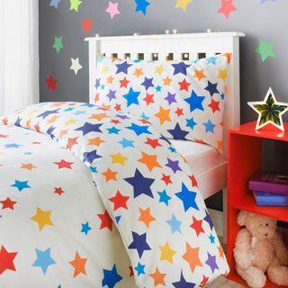 kids bedroom with star bedsheet and pillow cover