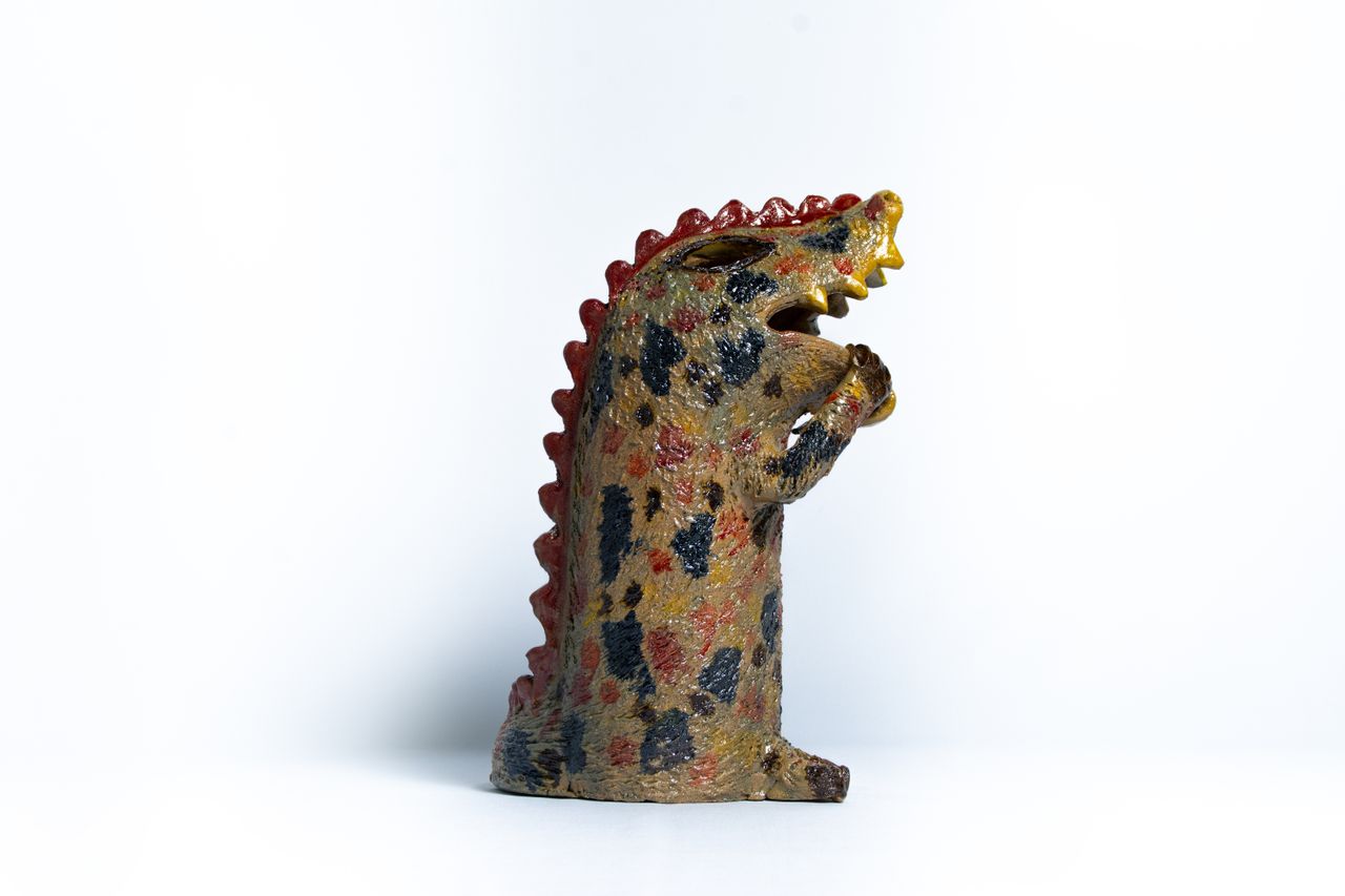 Colourful animal head ceramic vessels