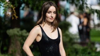 The Last Of Us season 2 star Kaitlyn Dever wearing a black dress at the Michael Kors fashion show in New York Fashion Week: The Shows at Domino Park on September 11, 2023