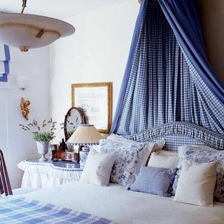 bedroom with crisp blue and side table