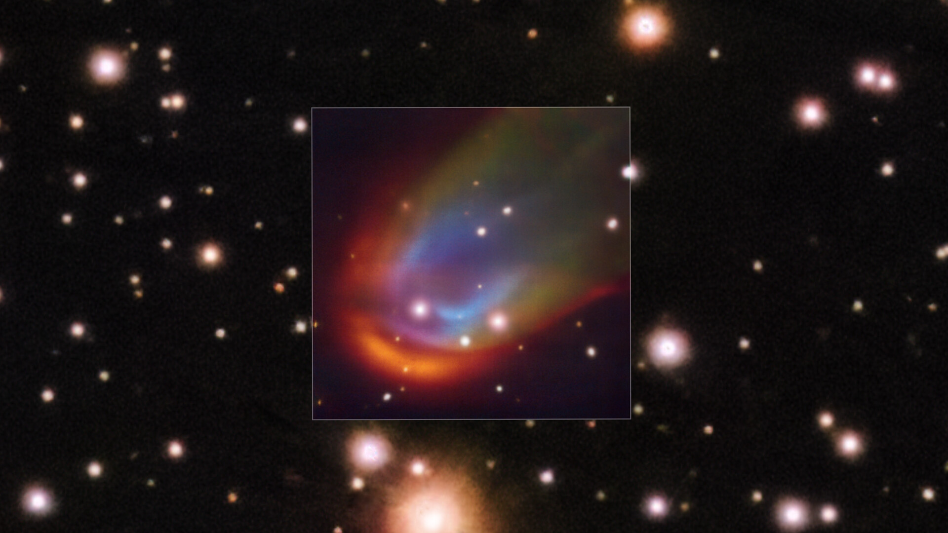 a colorful cloud of gas, round at one end and wispy at the other, on a starry background