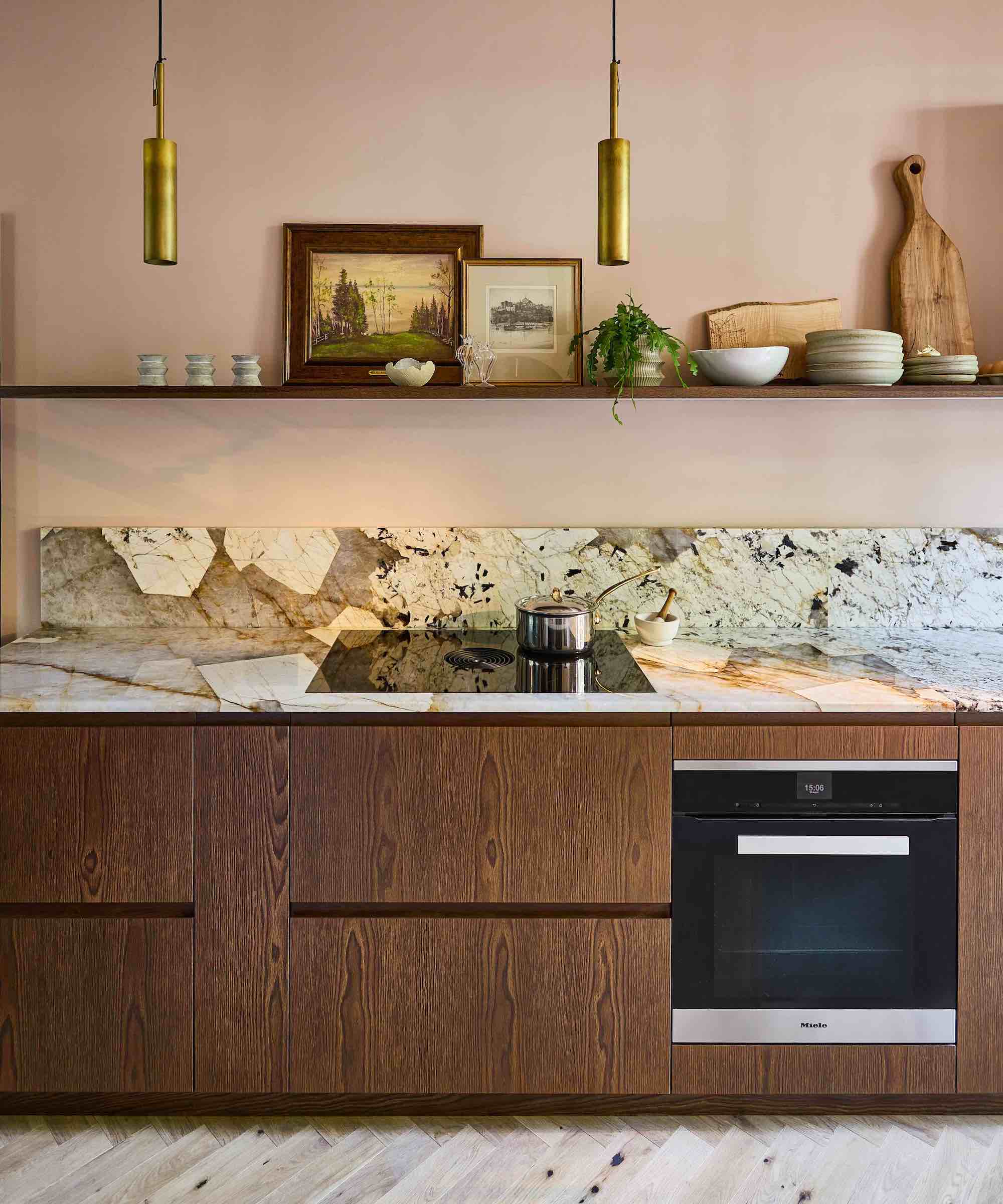 wood kitchen with marble tops