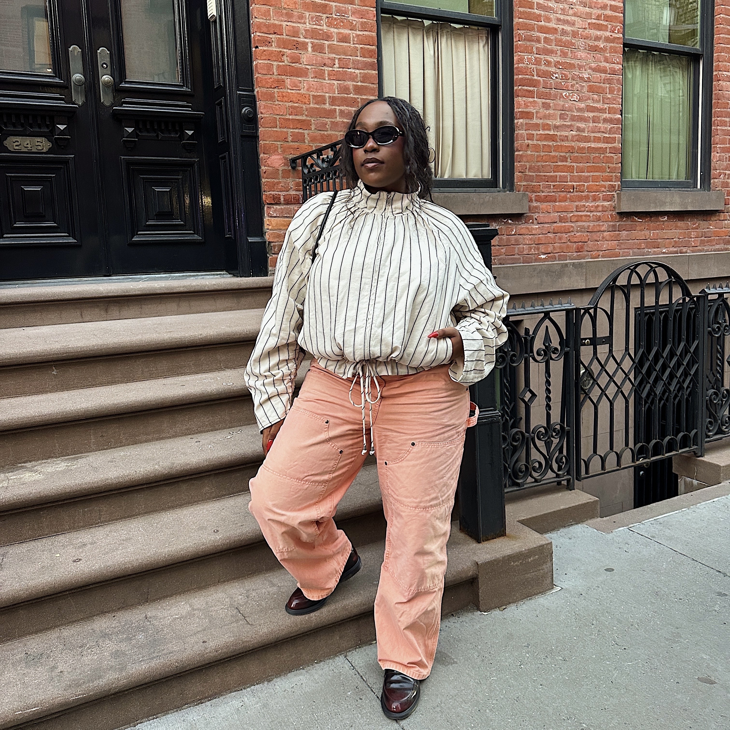 Editor standing on New York City stoop