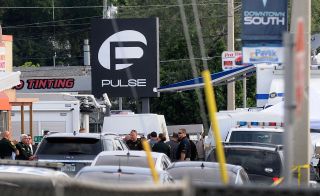 Police officers outside Orlando’s Pulse club, the scene of the fatal shootings