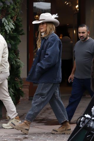 Jennifer Lopez is seen on December 29, 2024 in Aspen, Colorado wearing barrel leg jeans and an ivory cowboy hat