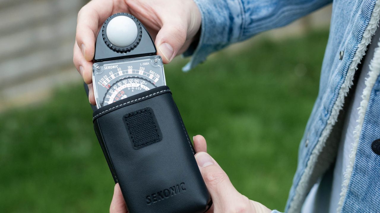 Placing Sekonic Studio Deluxe III L-398A in leatherette pouch