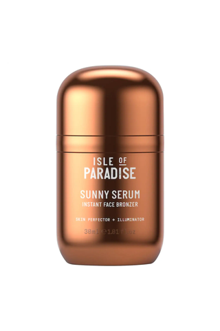 A bronze-colored bottle of Isle of Paradise Sunny Serum Instant Face Bronzer against a white background.