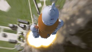 This artist rendering shows an aerial view of the liftoff of NASA’s Space Launch System (SLS) rocket.