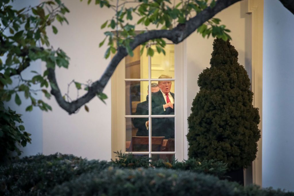 Trump and Barr talking in the Oval Office