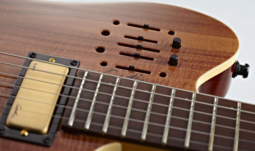 This is a fully featured system, with volume for both the piezo and magnetic pickups, two EQs, and two outputs for dual-amp setups