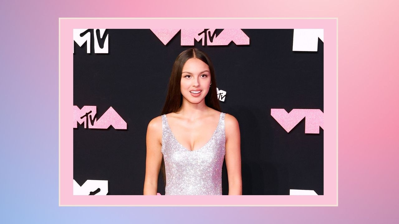 Olivia Rodrigo at the 2023 VMAs wearing a silver glittery dress