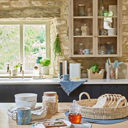 dining table in kitchen with exposed brickwork