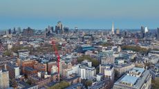 Aerial view of London looking east across Bloomsbury and Holborn toward the financial district at dusk.