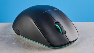 A black and teal Cherry XTRFY M64 Wireless gaming mouse