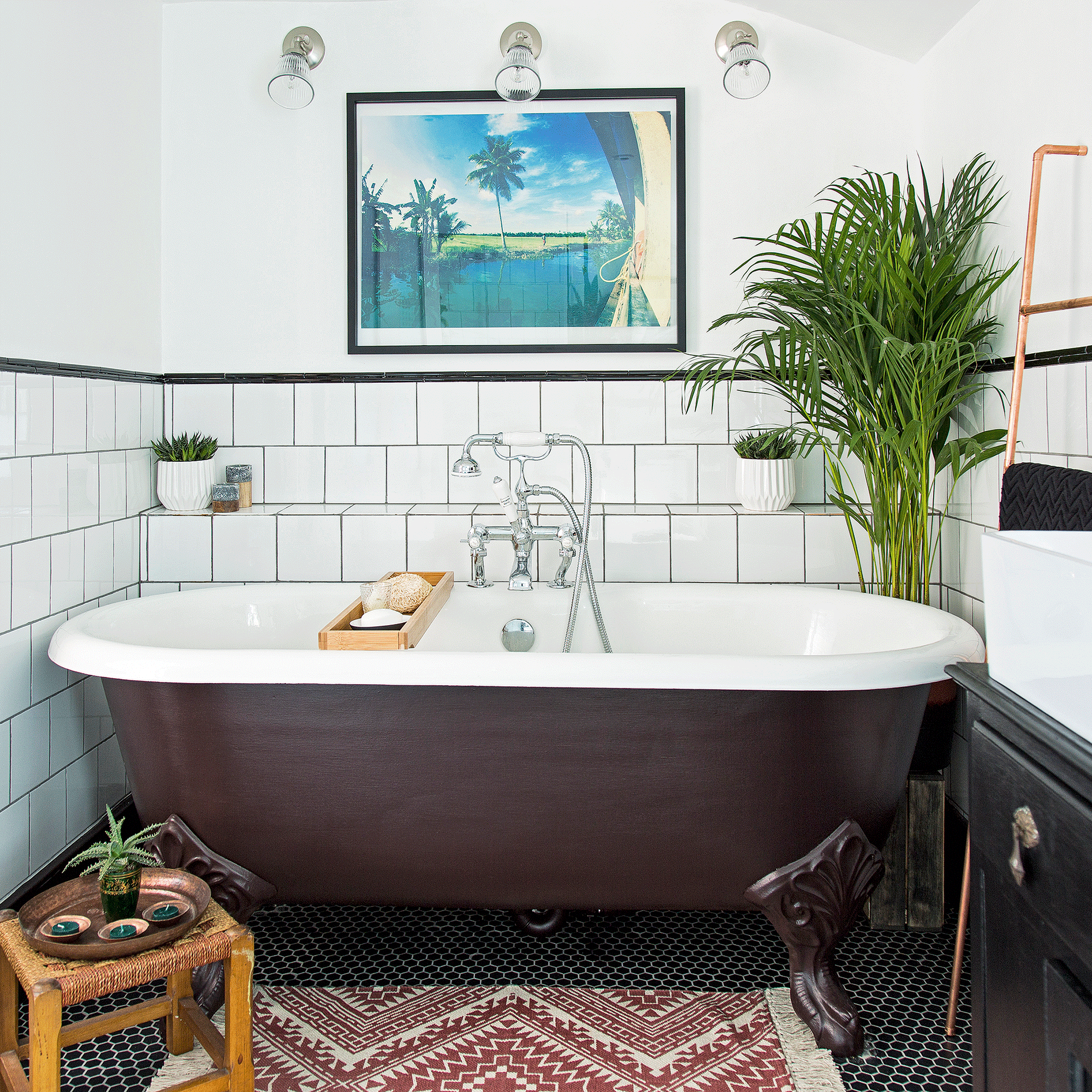 Red bathtub and white tiles with plant