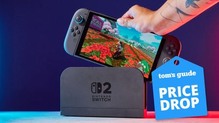 A Nintendo Switch 2 running Mario Kart World being taken out of the Switch 2 dock.