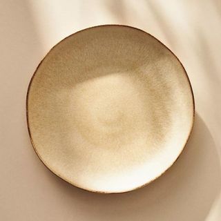 Jasper Portuguese Dinner Plate against a gold background.