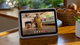 The Facebook Portal Go smart display being used to make a video call in a kitchen setting