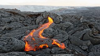 Lava pours out of a crack in the southwest rift zone during the most recent eruption of Kilauea