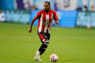 Brentford squad for 2024/25 ATLANTA, GEORGIA - JULY 26: Rico Henry of Brentford controls the ball during the Premier League Summer Series match between Brentford FC and Brighton & Hove Albion at Mercedes-Benz Stadium on July 26, 2023 in Atlanta, Georgia. (Photo by Todd Kirkland/Getty Images for Premier League)