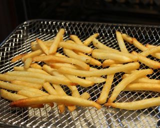 Cooking French fries in the Our Place Wonder Oven Air Fryer