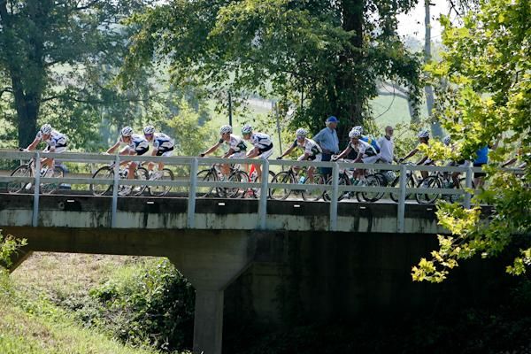 Riders cross one of the many narrow bridges as they got closer to town.
