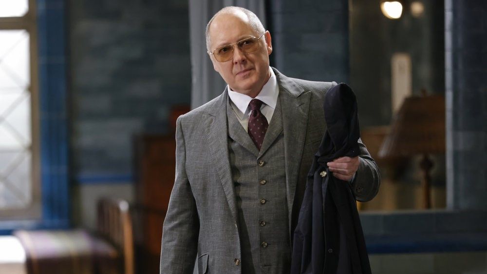 James Spader as Raymond &quot;Red&quot; Reddington in a grey suit and sunglasses in The Blacklist season 10