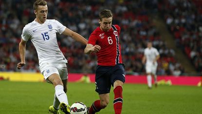 England's Calum Chambers and Norway's Stefan Johansen