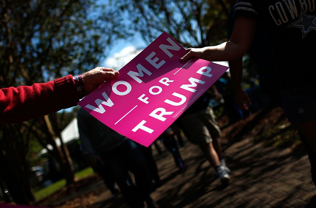 Women for Trump sign.