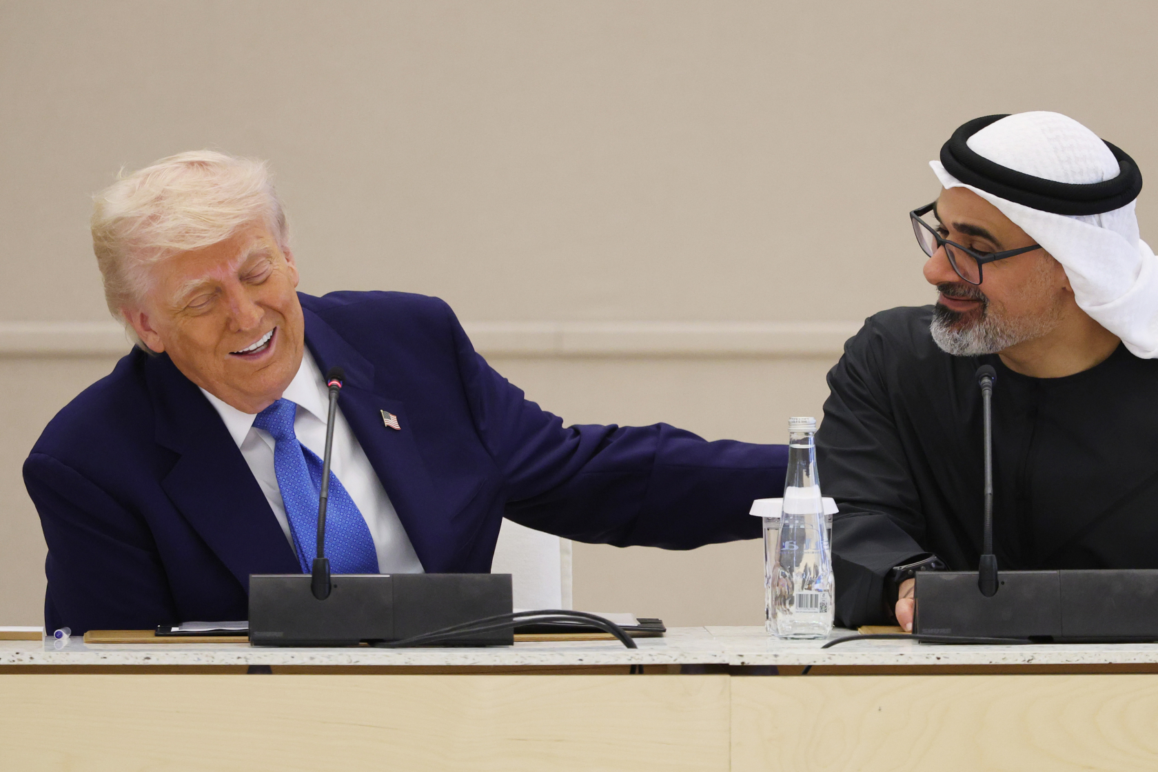 ABU DHABI, UNITED ARAB EMIRATES - MAY 16: U.S. President Donald J. Trump and Crown Prince of Abu Dhabi Khaled bin Mohamed Al Nahyan participate in a US-UAE Business Council roundtable meeting at Qasr al-Watan, presidential palace of the United Arab Emirates, on May 16, 2025, in Abu Dhabi, United Arab Emirates. Trump is on the fourth and final day of his visit to the Gulf to underscore the strategic partnership between the United States and regional allies including the UAE, focusing on security and economic collaboration. 