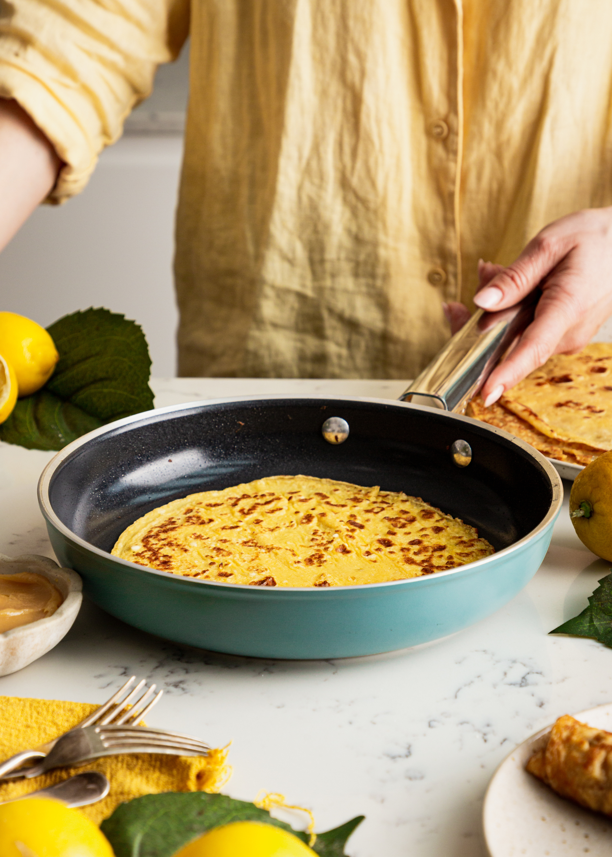 pancakes in a emerald green pan