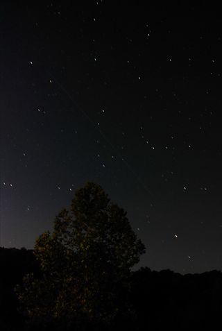 This photo of China's Tiangong 1 spacecraft was taken by amateur observer Justin Cowart in Carbondale, Ill.
