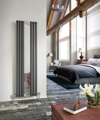 Mirrored radiator idea in bedroom by The Radiator Centre
