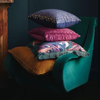 velvet armchair with cushions